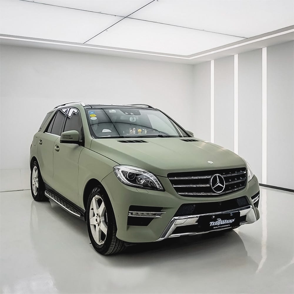 Mercedes-Benz SUV wrapped in TeckWrap Matte Lizard Grey vinyl film, featuring full body coverage in a professional studio setup.