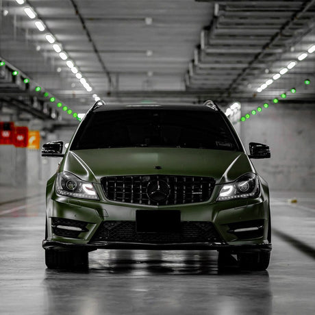 Front view of a Mercedes-Benz SUV wrapped in Military Green (CM09) super matte vinyl by TeckWrap, featuring blacked-out grille, and a bold, aggressive stance.