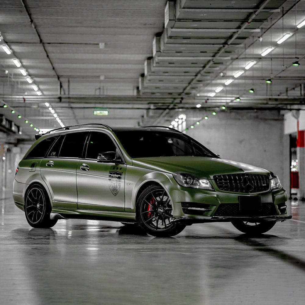 Military Green (CM09) super matte vinyl wrap by TeckWrap applied to the car, showcasing a smooth, non-reflective finish with a sleek, muted green tone that gives a bold and tactical appearance.