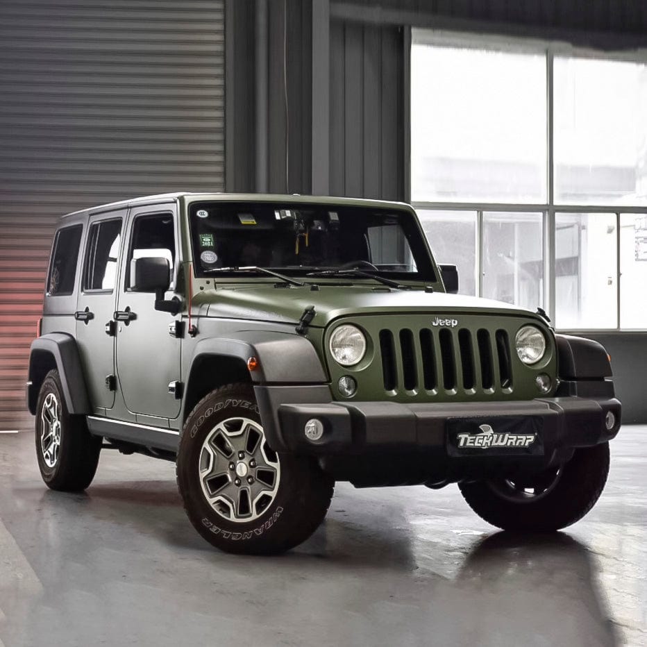 Jeep wrapped in TeckWrap Piniengruen Pearl Matte Vinyl Wrap (TC02), parked indoors, emphasizing the luxurious military-green appearance.