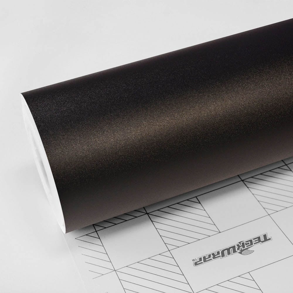 Close-up roll of TeckWrap Sandy Black (CM01-MS) matte vinyl wrap, highlighting its refined matte texture and subtle grain finish.