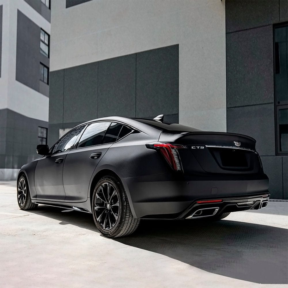 Sleek Cadillac CTS elegantly wrapped in TeckWrap Sandy Black (CM01-MS) matte vinyl, demonstrating its sophisticated matte look and luxurious finish.