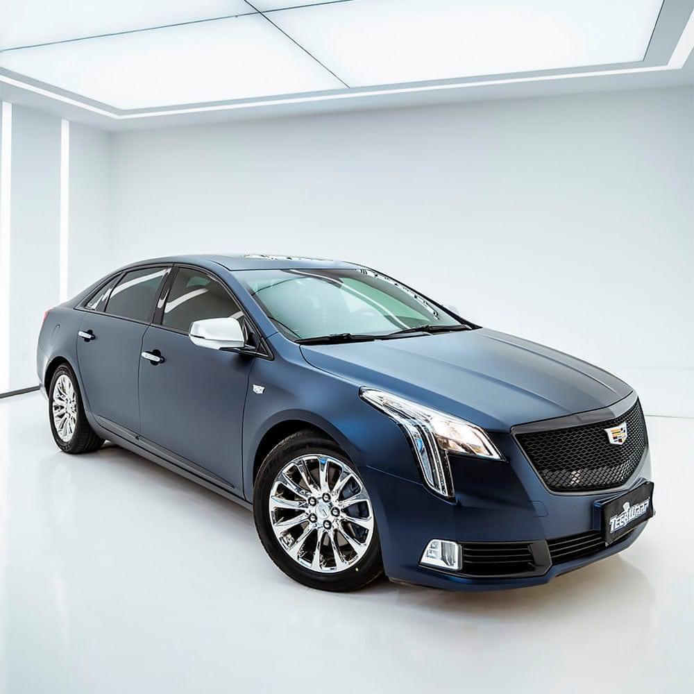Front and side angle of a Cadillac wrapped in TeckWrap Satin Boysenberry Black (SMT04), emphasizing a sophisticated matte appearance