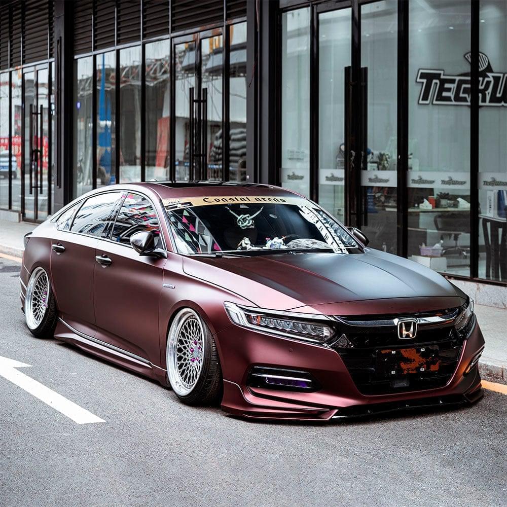Custom-wrapped Honda sedan featuring TeckWrap Satin Burnt Maroon (SMT02) Vinyl Wrap, elegantly accentuating the vehicle’s contours with a sophisticated satin maroon finish.