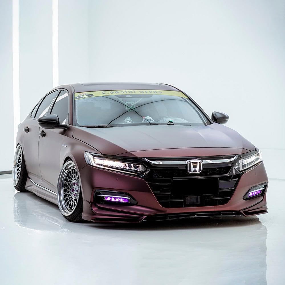 Studio shot of a Honda sedan wrapped in TeckWrap Satin Burnt Maroon (SMT02) Vinyl Wrap, emphasizing the stylish matte-maroon aesthetic and distinctive automotive styling.
