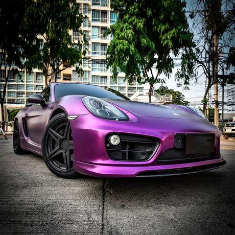 Stylish Porsche wrapped with TeckWrap Concord Grape VCH403-S Satin Vinyl, highlighting its sophisticated satin purple appearance in outdoor setting.