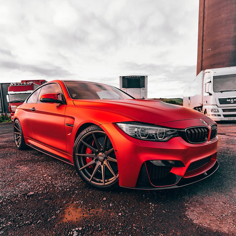Luxury BMW with Crimson Red Satin Vinyl Wrap (VCH401-S) – A striking BMW car showcasing the premium finish and deep, vibrant crimson hue of TeckWrap's Satin Crimson Red vinyl wrap, enhancing its sporty and sleek design.