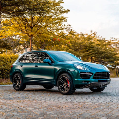 Luxury SUV professionally wrapped in TeckWrap Forest Green (ECH19) Satin vinyl, accentuating the sleek contours and refined look of the vehicle.