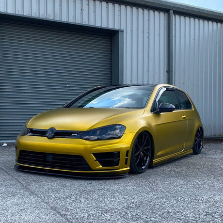 Volkswagen wrapped in TeckWrap Golden Yellow (VCH408-S) Satin Vinyl, showcasing sleek styling.
