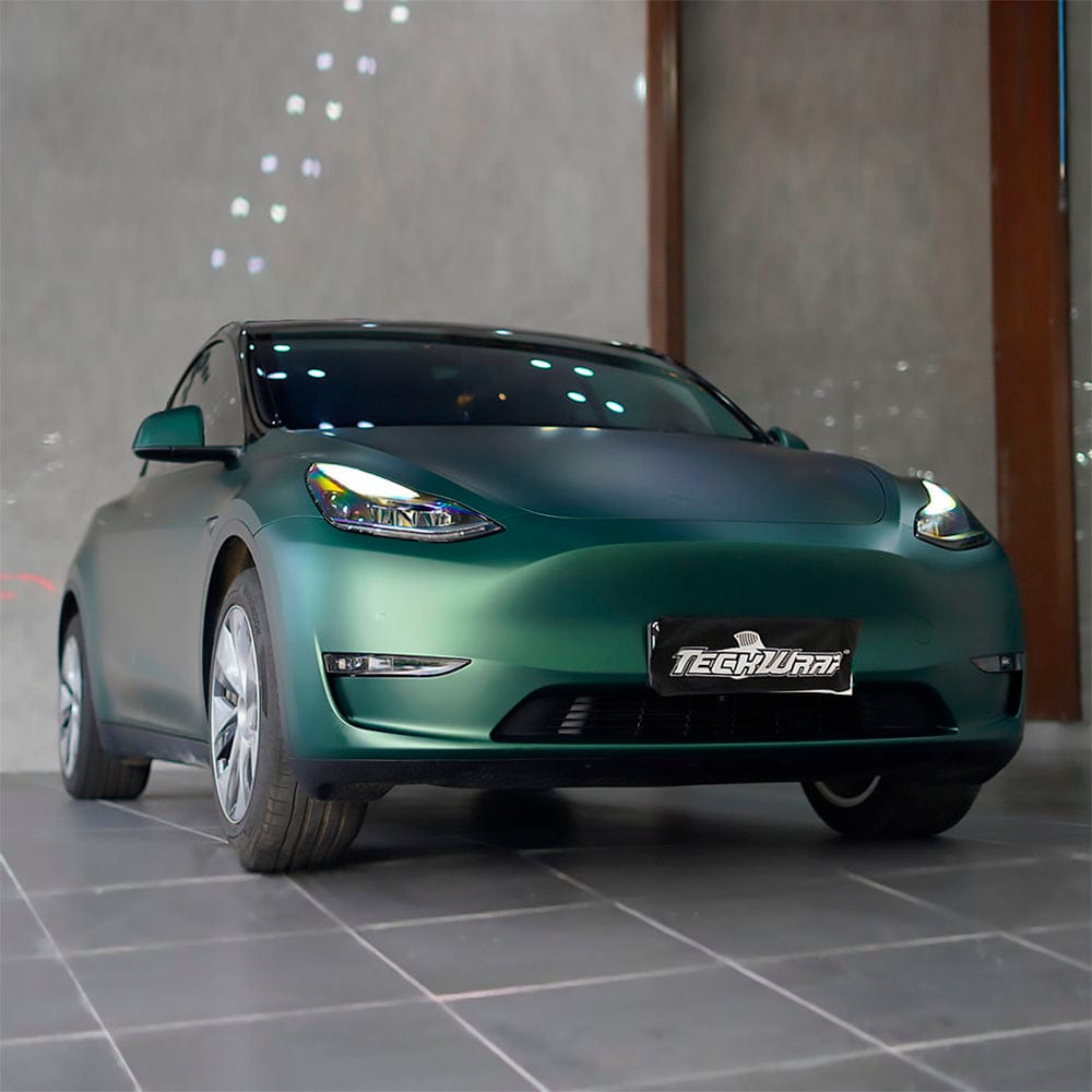 Tesla car wrapped in TeckWrap Green Mantle (SMT05) satin vinyl, highlighting the premium finish, sophisticated color depth, and professional wrap application.