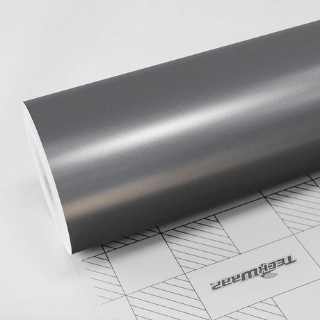 Close-up of Gunmetal Grey satin vinyl wrap roll by TeckWrap, showcasing its smooth semi-matte finish.