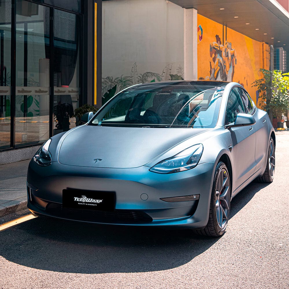 Front angle of Tesla Model 3 with TeckWrap SMT19 silver blue satin wrap highlighting premium finish