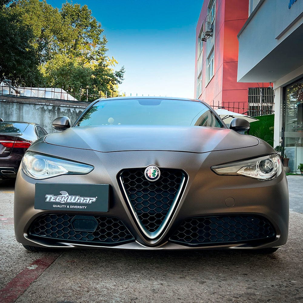 Alfa Romeo stylishly wrapped in TeckWrap Onyx Grey (SMT09) Satin Vinyl, demonstrating a luxurious and sophisticated vehicle finish.