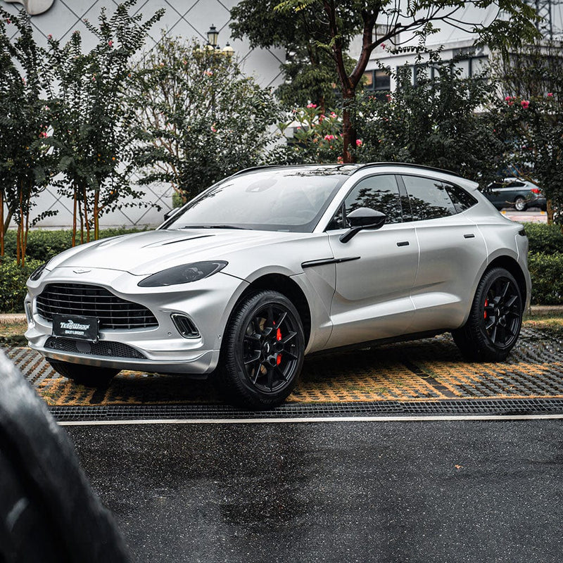 Aston Martin SUV wrapped in TeckWrap Super Silver Sage (VCH411-S) satin vinyl, displaying the sleek and luxurious silver appearance.