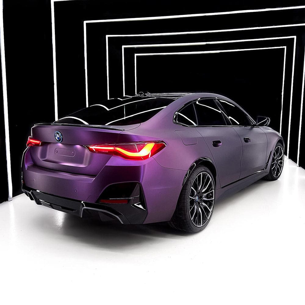 Rear-angle studio shot of BMW showcasing TeckWrap Satin Venetian Violet (SMT03) vinyl wrap, highlighting the sophisticated satin texture and deep violet shade under professional lighting.