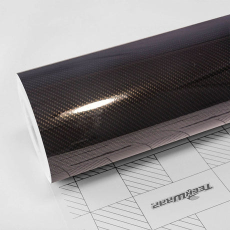 TeckWrap Ceramic Carbon (RCF03) vinyl wrap roll close-up, showcasing a glossy carbon fiber finish with deep, textured patterns ideal for automotive styling.