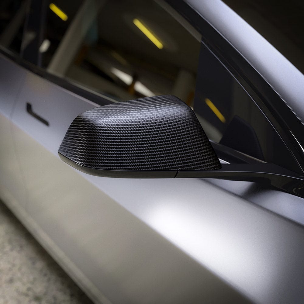 Side mirror wrapped with TeckWrap Noir Black Carbon (CF01) Vinyl, emphasizing the structured carbon fiber texture for a sleek automotive finish.