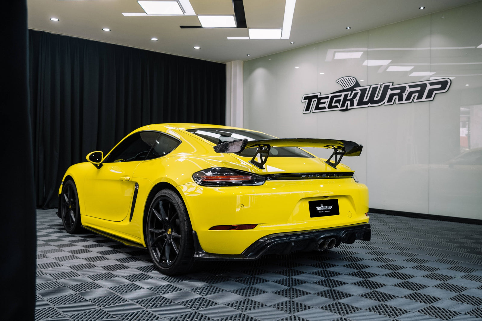 Overlaying vinyl on side light for Porsche wrapping | TeckWrap