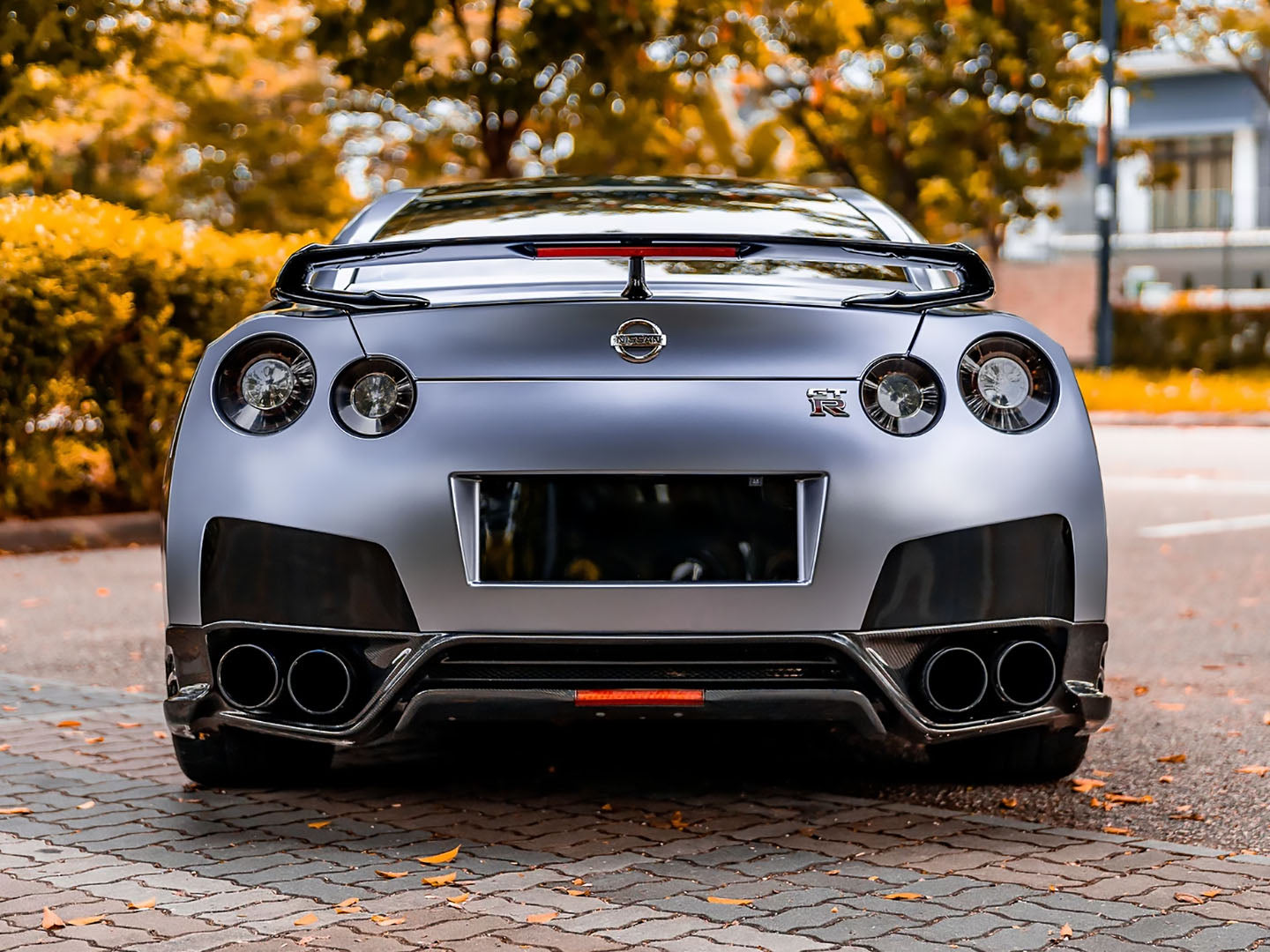 Wrap license plate area with chrome vinyl