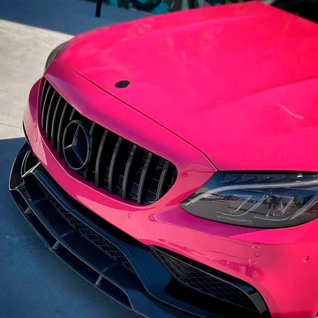 Close-up of front bumper and headlight of a car wrapped in TeckWrap Berry Red (CG49-HD) gloss film