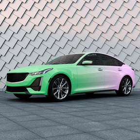 TeckWrap Purple to Green Gradient Custom Vinyl से रैप की गई सेडान – आधुनिक ऑटोमोटिव स्टाइलिंग के लिए आकर्षक ग्रेडिएंट कार रैप।