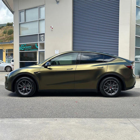 Side profile of Tesla Model Y fully wrapped in TeckWrap HM09 satin gold vinyl wrap