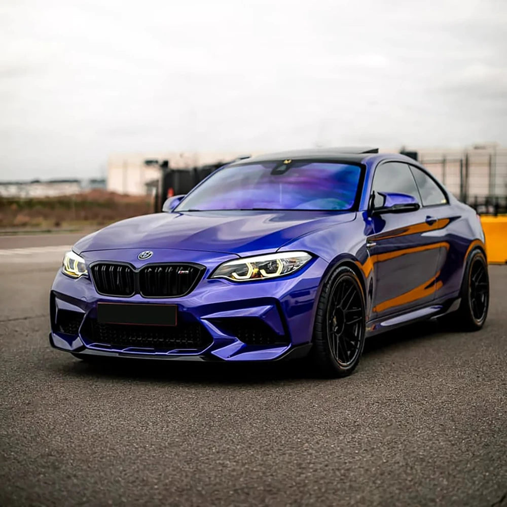 Full exterior shot of BMW M series finished with TeckWrap Deep Blue RB02-HD vinyl wrap on urban road background