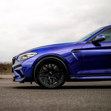 Front wheel and fender view of BMW wrapped in TeckWrap Deep Blue RB02-HD premium car vinyl wrap