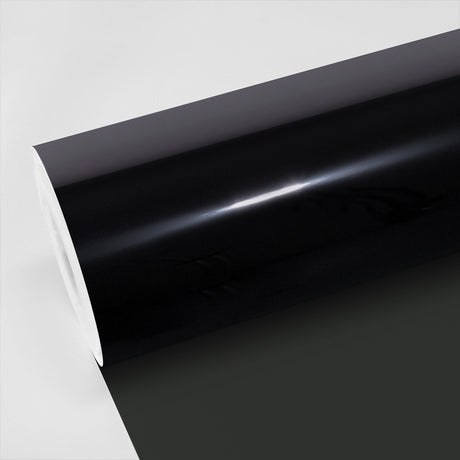 Close-up view of TeckWrap Zenith05 Window Film, showcasing its glossy, deep-black finish on a roll, ideal for superior window tinting and enhanced privacy.