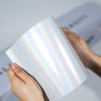 TeckWrap A5 Pearlescent Paint Protection Film sample in white with rainbow holographic shine