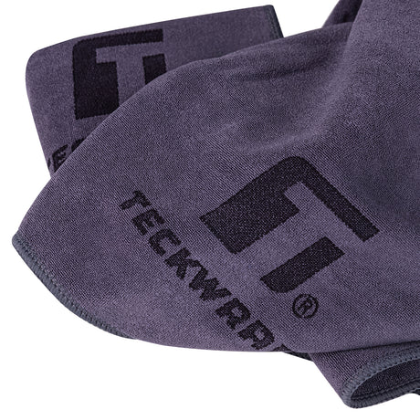 TeckWrap detailing towel unfolded to highlight plush fabric and embroidery