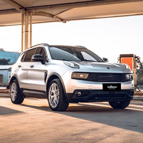 Front-side view of an SUV wrapped with TeckWrap Super Silver Sage (VCH411-S) satin vinyl, emphasizing its sophisticated satin silver finish under natural lighting.