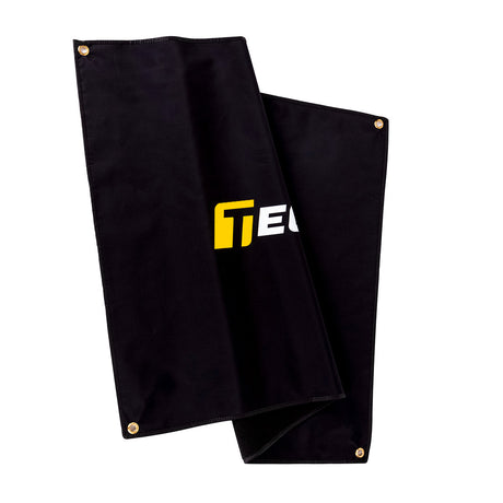 Folded TeckWrap logo banner showing high-quality black fabric and grommeted corners for durable use in automotive spaces