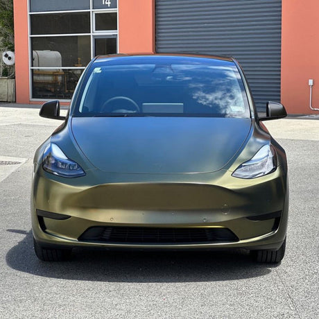 Front view of Tesla Model Y wrapped in Greenfinch Gold satin metallic TeckWrap film