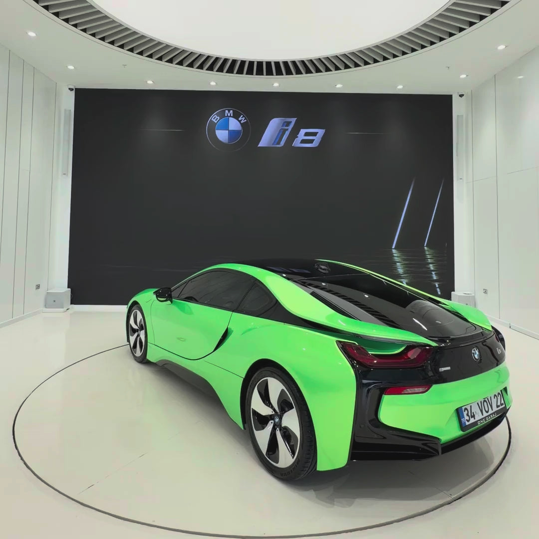 BMW i8 wrapped in TeckWrap Gloss Green Kelly Green vinyl (RB22-HD), rotating showroom view of the gloss green finish
