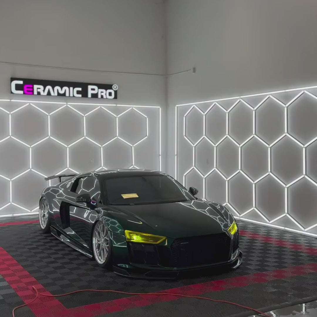 Audi R8 wrapped in TeckWrap Deep Gloss Hunter Green vinyl (GAL29-HD), showing the glossy green finish reflecting studio lighting
