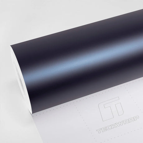 Satin Serge Blue Vinyl Wrap VCH419-M roll on TeckWrap liner showing a muted dark blue finish with a soft icy blue highlight