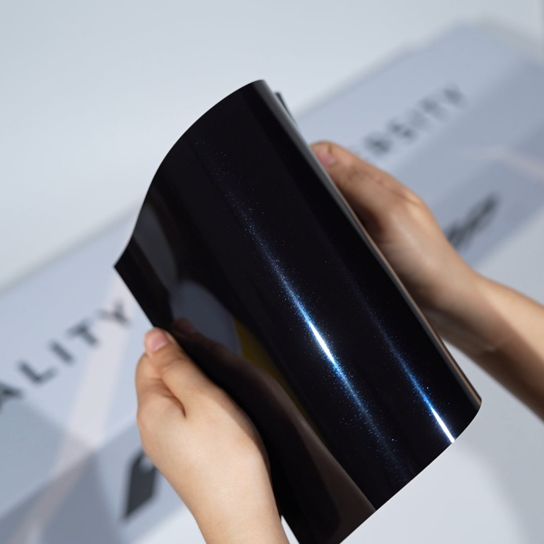 TeckWrap A5 Metallic PPF sample in black with subtle blue pearl reflection