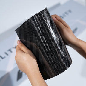 TeckWrap A5 carbon fiber color Paint Protection Film sample showing glossy black woven texture and flexible PPF sheet