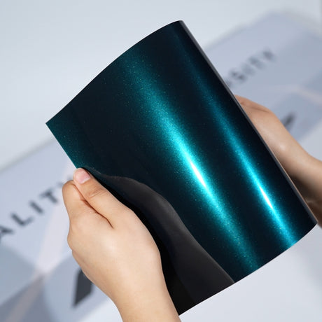 TeckWrap A5 Pearlescent Color PPF sample in deep teal with bright cyan metallic glow