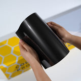 TeckWrap A5 black Paint Protection Film sample with deep glossy finish and clean reflection