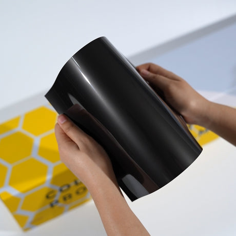 TeckWrap A5 black Paint Protection Film sample with deep glossy finish and clean reflection