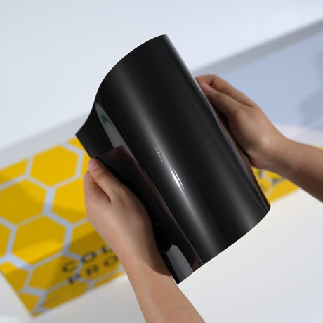 TeckWrap A5 Metallic Paint Protection Film sample of CPX408 in glossy black with a soft silver reflection