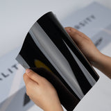 Gloss black TeckWrap A5 Pure Color PPF sample with strong reflective surface