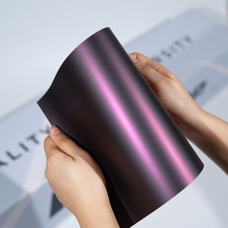 TeckWrap A5 Pearlescent Color PPF sample showing dark black base with soft rose pink metallic glow
