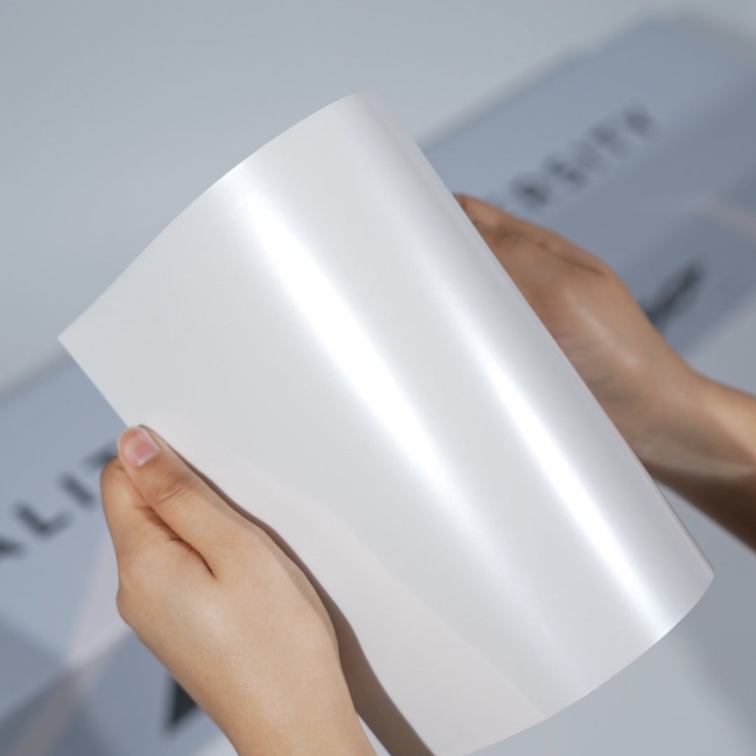 TeckWrap A5 Pearl White Paint Protection Film sample with smooth satin-gloss reflection