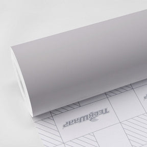 TeckWrap Granite Grey SCM47 satin chrome vinyl wrap roll with backing paper showing TeckWrap branding and grid pattern for precision cutting