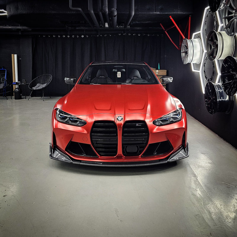 BMW M4 Competition wrapped in TeckWrap Satin Crimson Red vinyl (VCH401-S), front three-quarter view in a studio