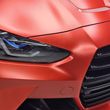 TeckWrap Satin Crimson Red vinyl (VCH401-S) wrapping cleanly around the headlight of a BMW M4