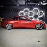 Side profile of a BMW M4 Competition in TeckWrap Satin Crimson Red vinyl wrap (VCH401-S)